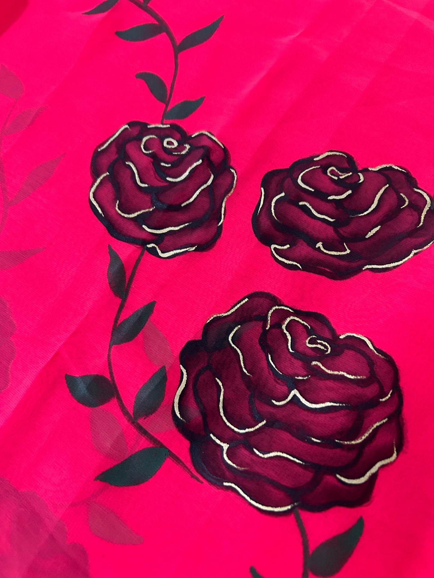 red handpainted saree with black rose. Chiffon fabric