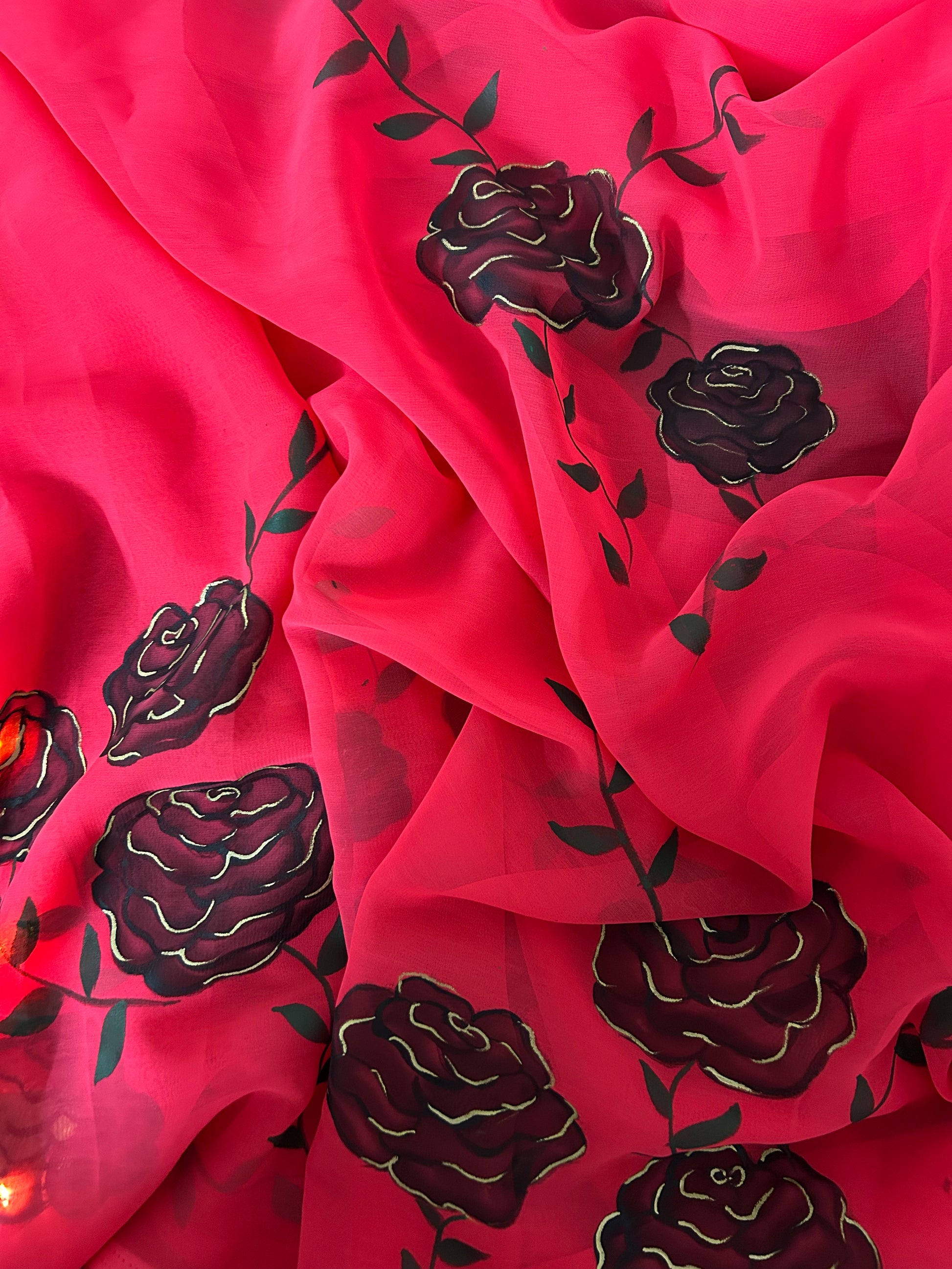 red handpainted saree with black rose. Chiffon fabric