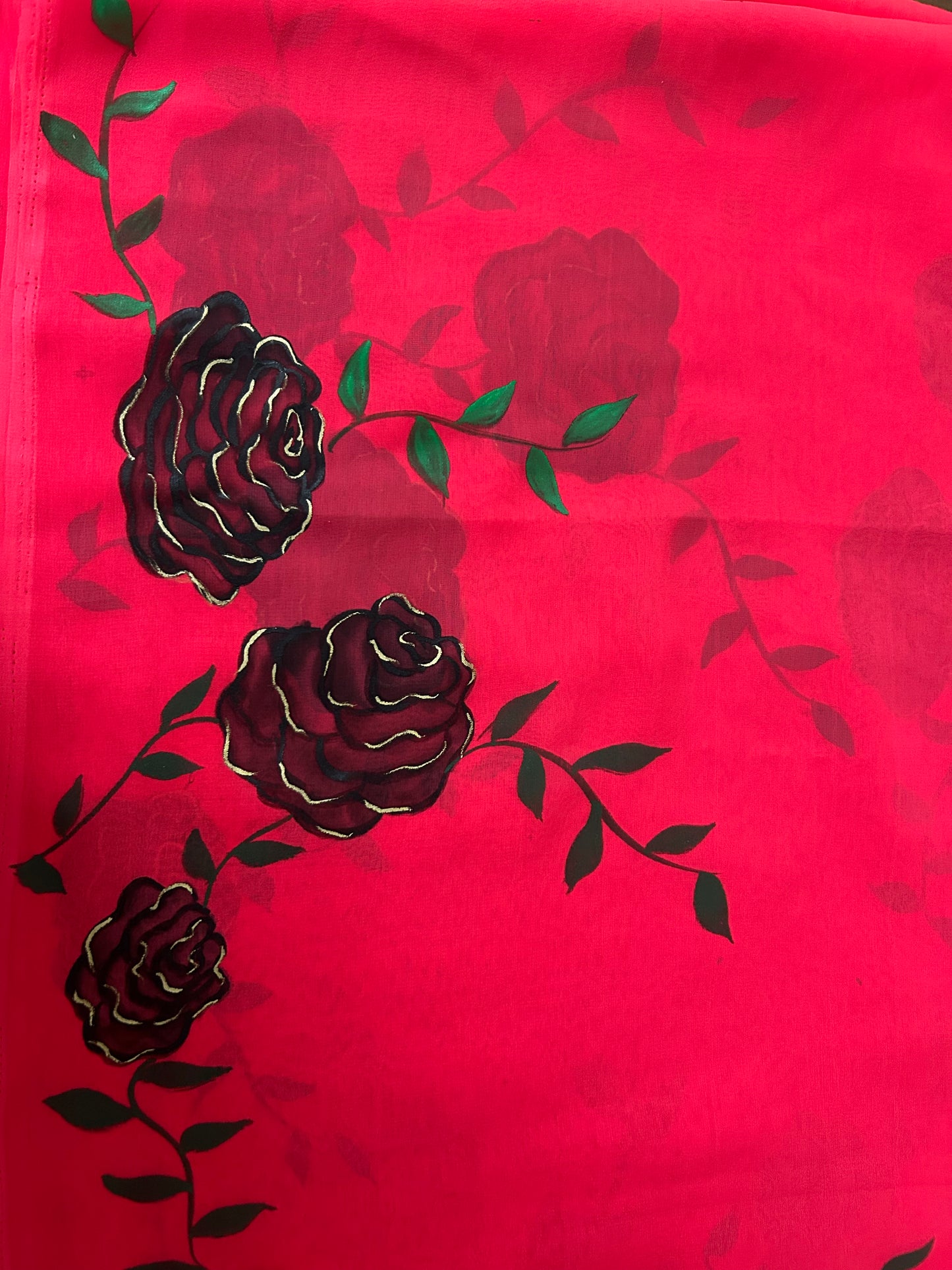 red handpainted saree with black rose. Chiffon fabric