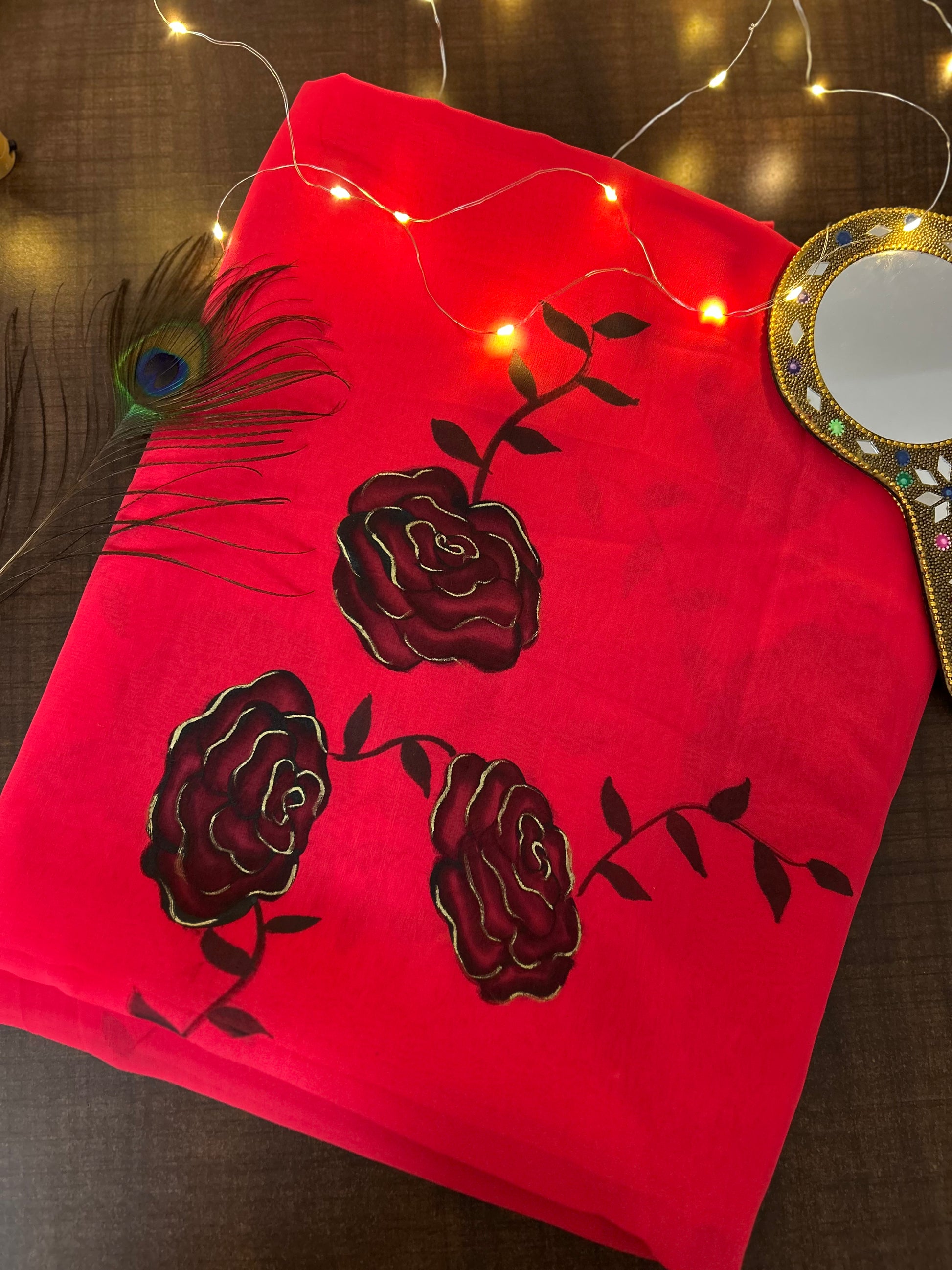 red handpainted saree with black rose. Chiffon fabric