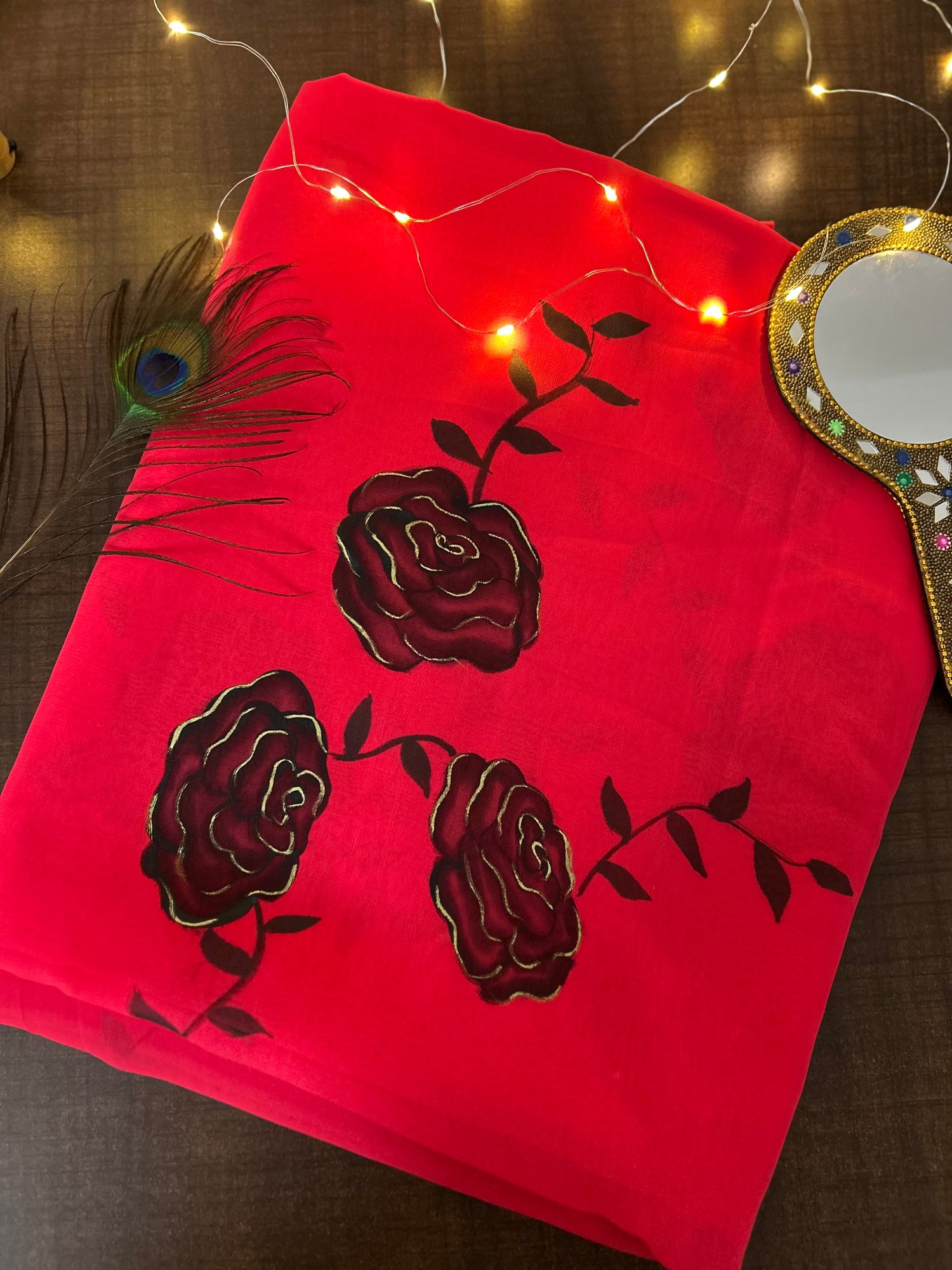 red handpainted saree with black rose. Chiffon fabric
